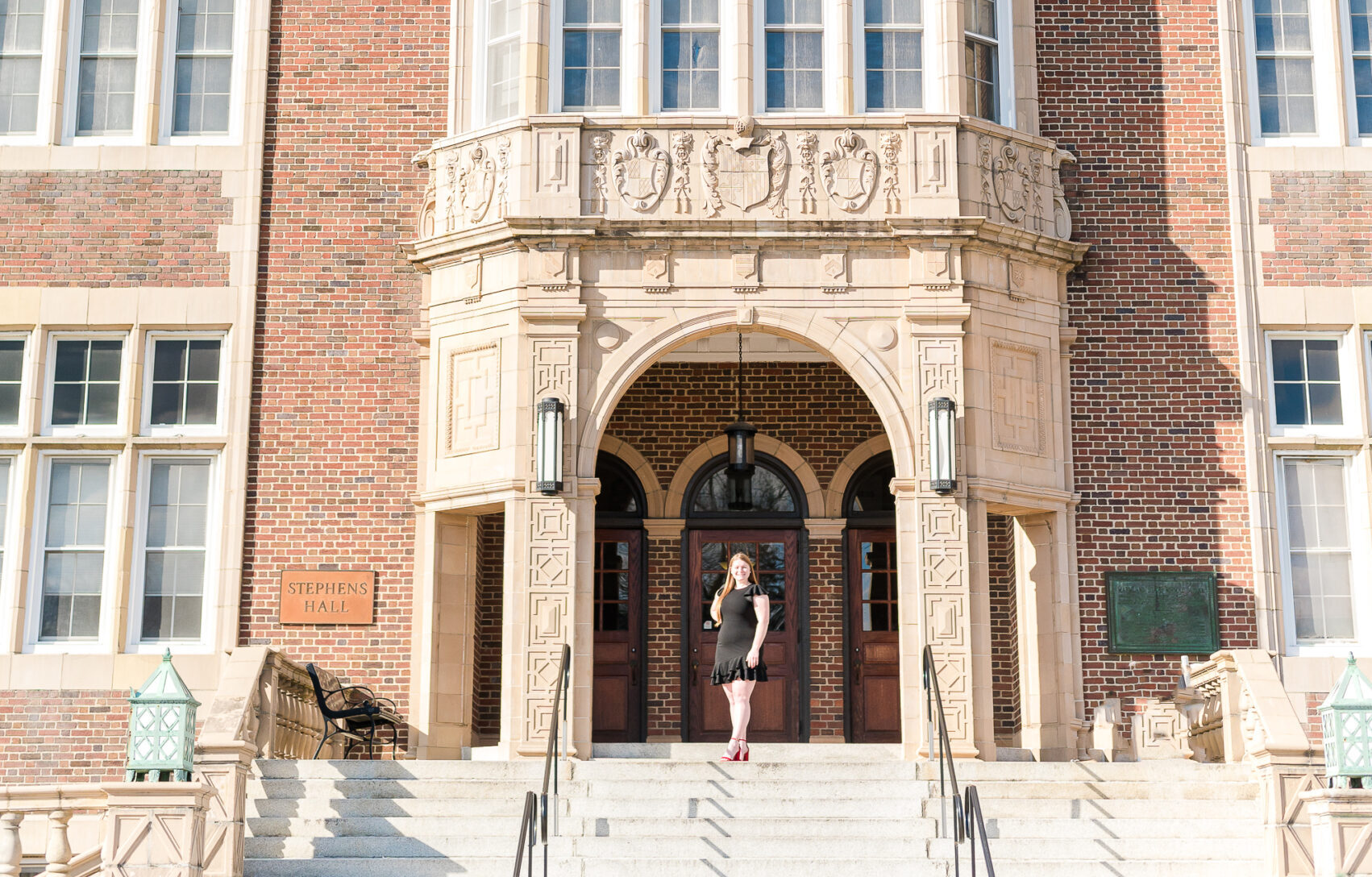 Girl on steps of college